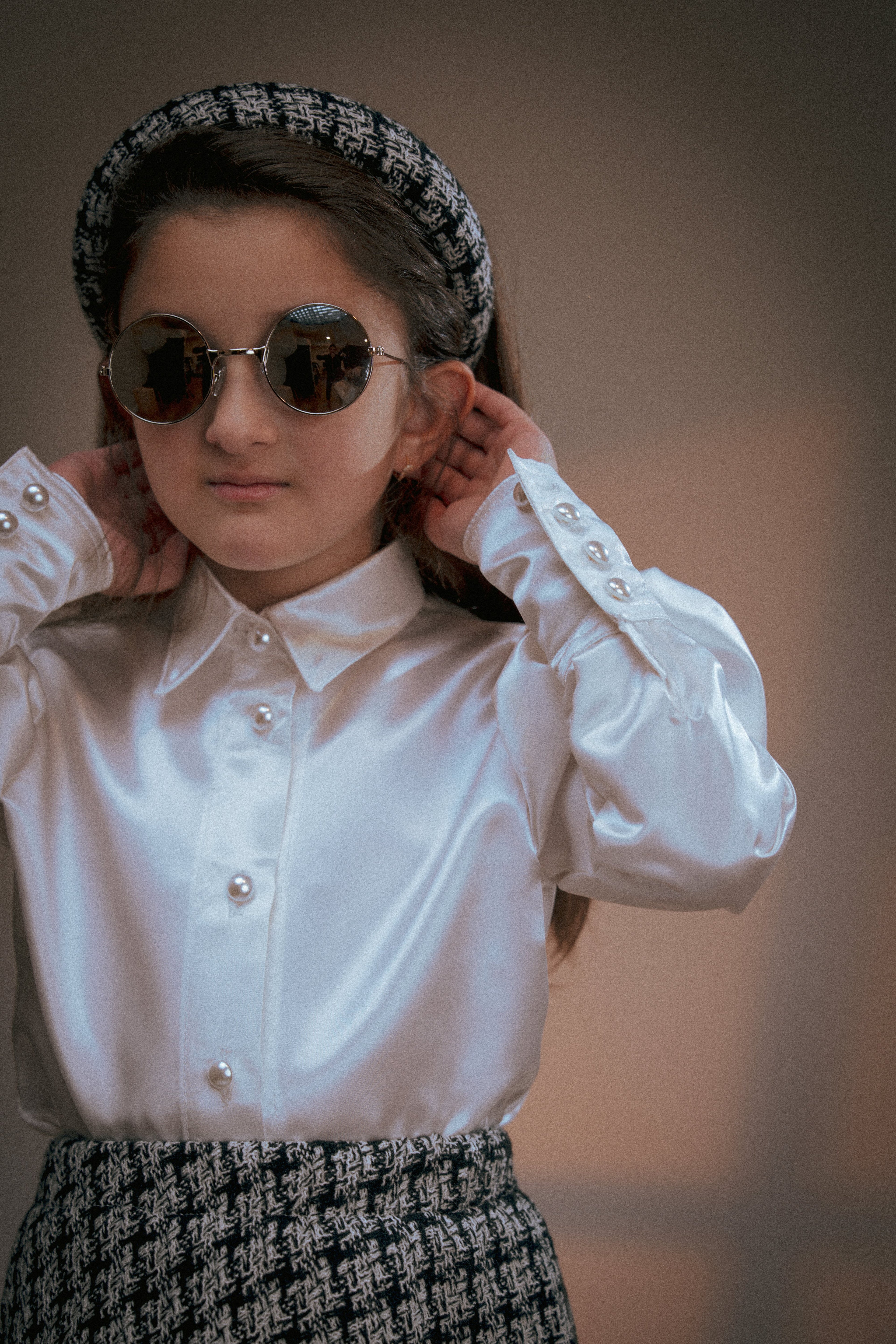 A white satin shirt adorned